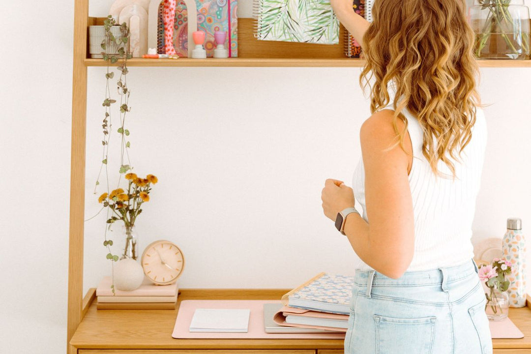 woman organising her desk for the end of the school year 