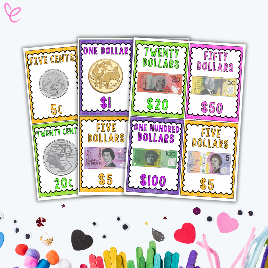 A fan display of Australian currency posters, each showcasing different denominations with images of coins and banknotes. The posters have vibrant colours and decorative borders, making them visually engaging for students learning about money. The background includes scattered craft materials like pom-poms and heart-shaped cutouts.