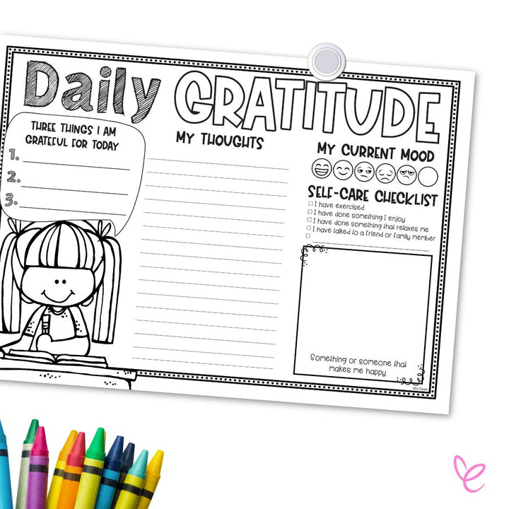 Black-and-white 'Daily Gratitude' worksheet pinned to a board, featuring sections for gratitude, thoughts, mood tracking, and a self-care checklist. A cartoon girl illustration sits on the left, with colourful crayons at the bottom