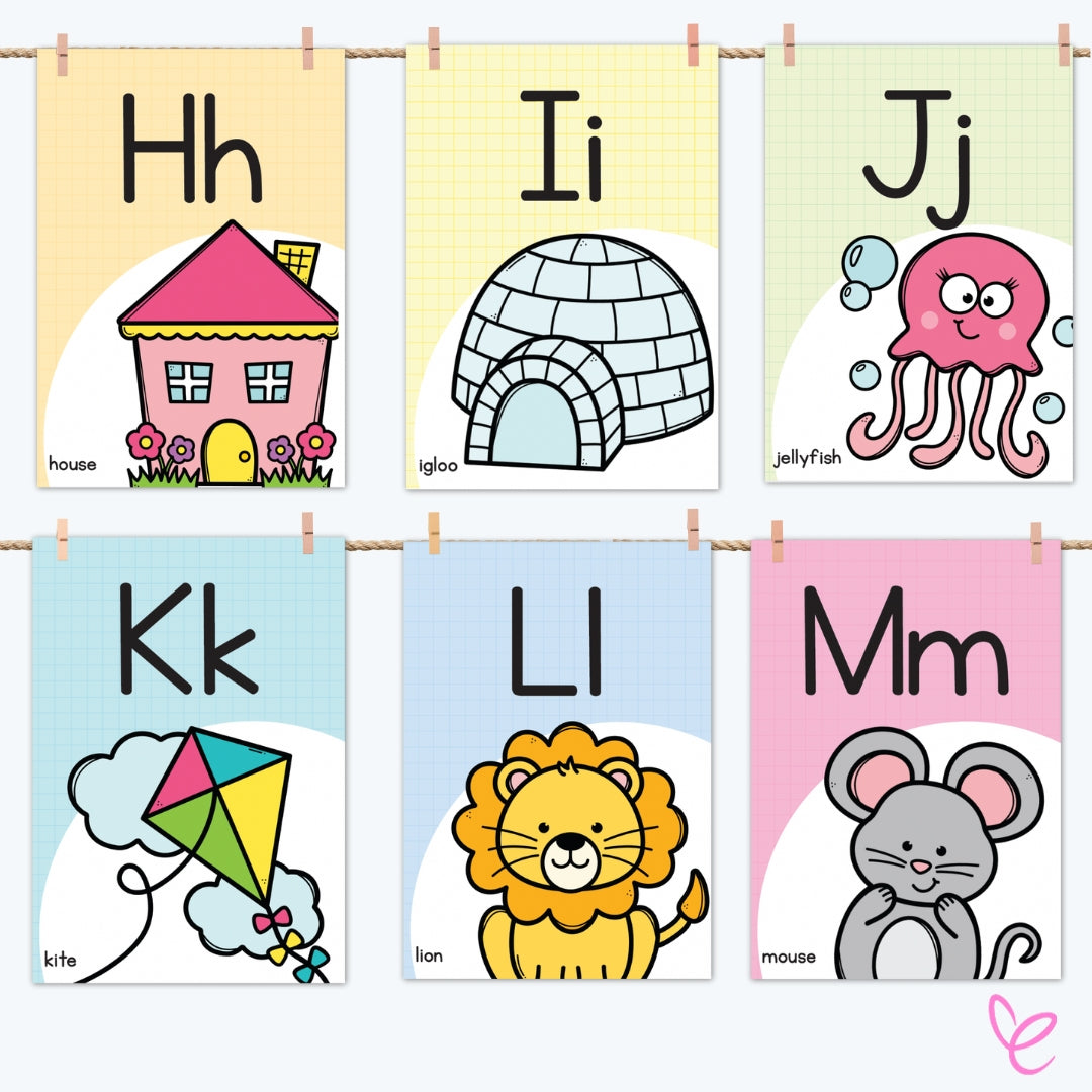 Digital alphabet posters displaying letters H, I, J, K, L, and M hanging on a rope by wooden pegs, creating a decorative classroom display.