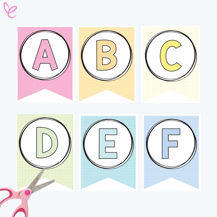 Printable alphabet bunting with letters A to F on pastel-coloured flags in pink, yellow, green, and blue. A pair of pink scissors is in the corner, suggesting a cut-and-assemble activity.