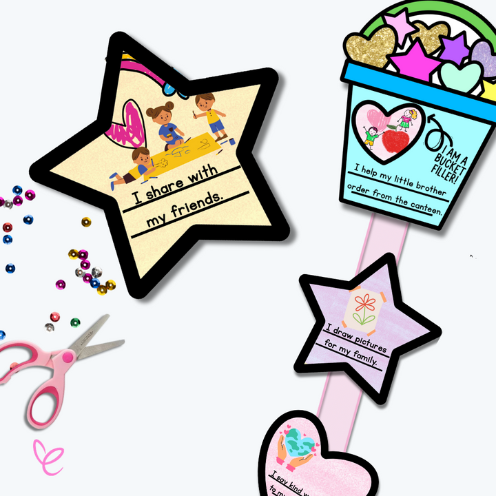 A close-up of a star-shaped kindness card reading 'I share with my friends,' placed next to a decorated bucket filler craft. The bucket is filled with glittery hearts and stars, and a pink ribbon connects kindness-themed shapes.