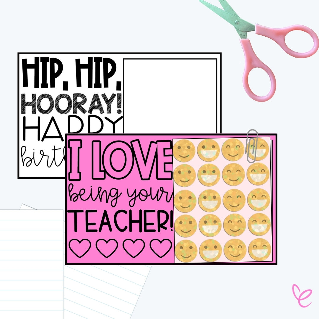 A crafting scene with a black and white birthday sign, a pink teacher appreciation sign reading "I LOVE being your TEACHER!" with heart designs, and a clipped sheet of smiley face stickers. Scissors and notebook paper are also visible.