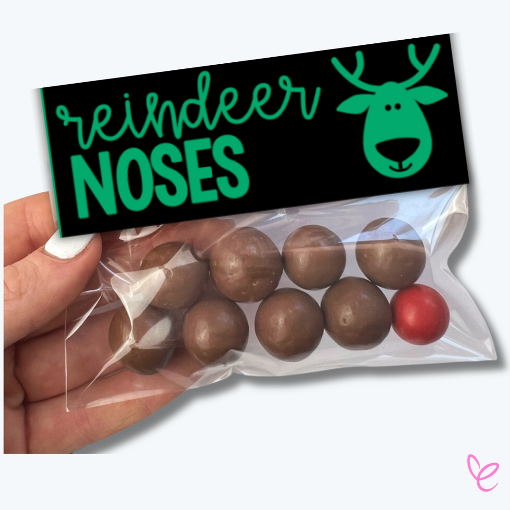 Digital Christmas Bag Topper shown folded and attached to a bag holding reindeer noses.