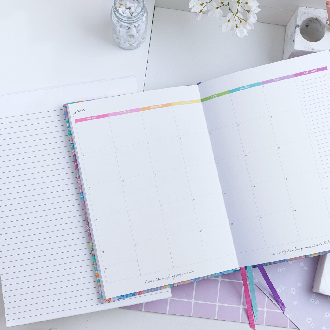 Open, general planner half off-screen, highlighting the left page of June's calendar. Weekdays in rainbow colours, with Aboriginal art - Jagun-Country.